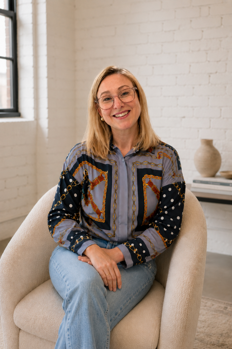 Jocelyn Mohr of Mohr Sweet Home seated in a loft-inspired interior.