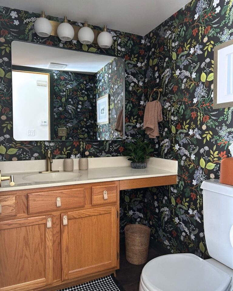Wide view of Essex Bath powder room with botanical wallpaper and brass fixtures